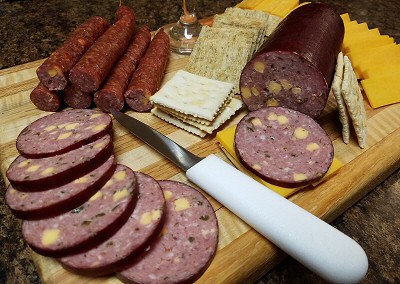 Sausage and snack sticks with cheese and crackers