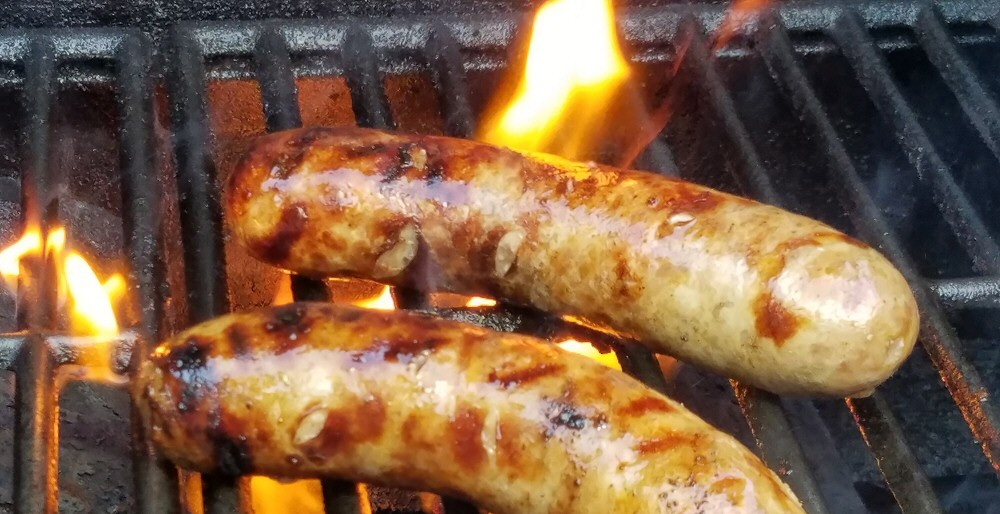 Bratwursts on a grill