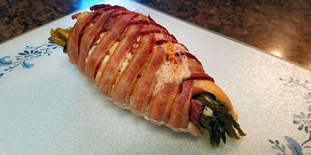 Bacon wrapped chicken breast stuffed with asparagus and cheese